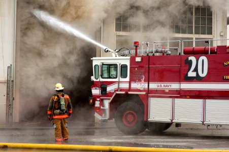 US Navy 110127-N-5319A-012 Firefighters work to put out a warehouse fire at Naval Station Norfolk photo