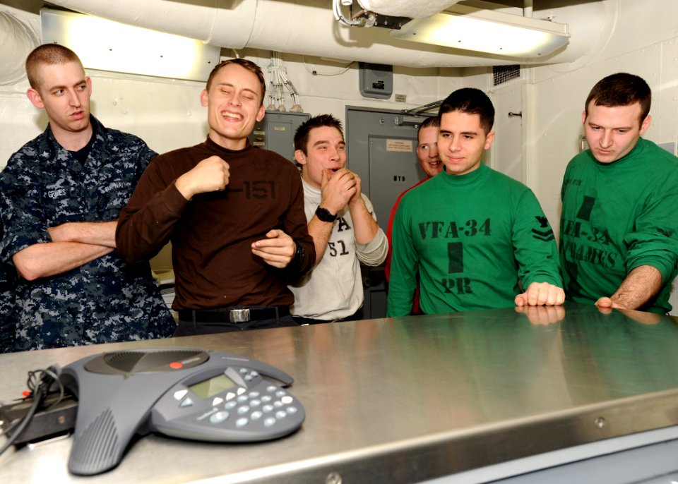 US Navy 101229-N-7095C-054 Sailors aboard the aircraft carrier USS Abraham Lincoln (CVN 72) speak with Boston Bruins goalie Tim Thomas