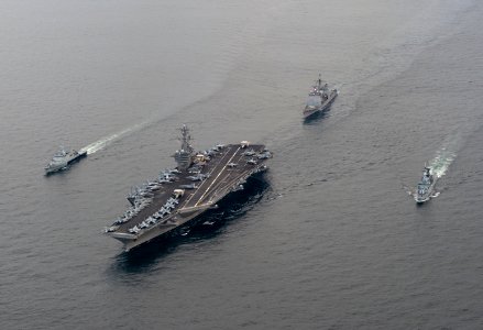 US Navy 110126-N-7981E-040 The Nimitz-class aircraft carrier USS Carl Vinson (CVN 70) leads the Royal Malaysian Navy frigate KD Lekir (FF 26) and c photo