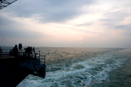 US Navy 110122-N-2953W-002 Sailors man a .50-caliber weapons mount as the aircraft carrier USS Carl Vinson (CVN 70) pulls into Port Klang, Malaysia