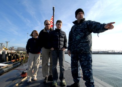 US Navy 101229-N-7705S-014 Lt. Cmdr. Robert Webster, engineering officer aboard the Los Angeles-class attack submarine USS Boise (SSN 764), explain photo