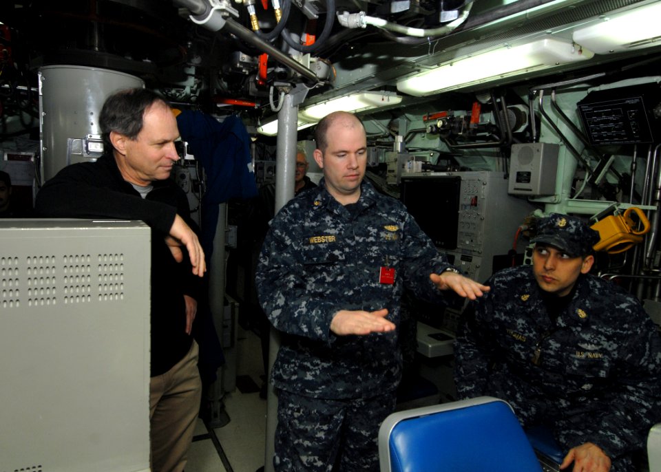 US Navy 101229-N-7705S-040 Lt. Cmdr. Robert Webster, engineering officer aboard the Los Angeles-class attack submarine USS Boise (SSN 764), explain