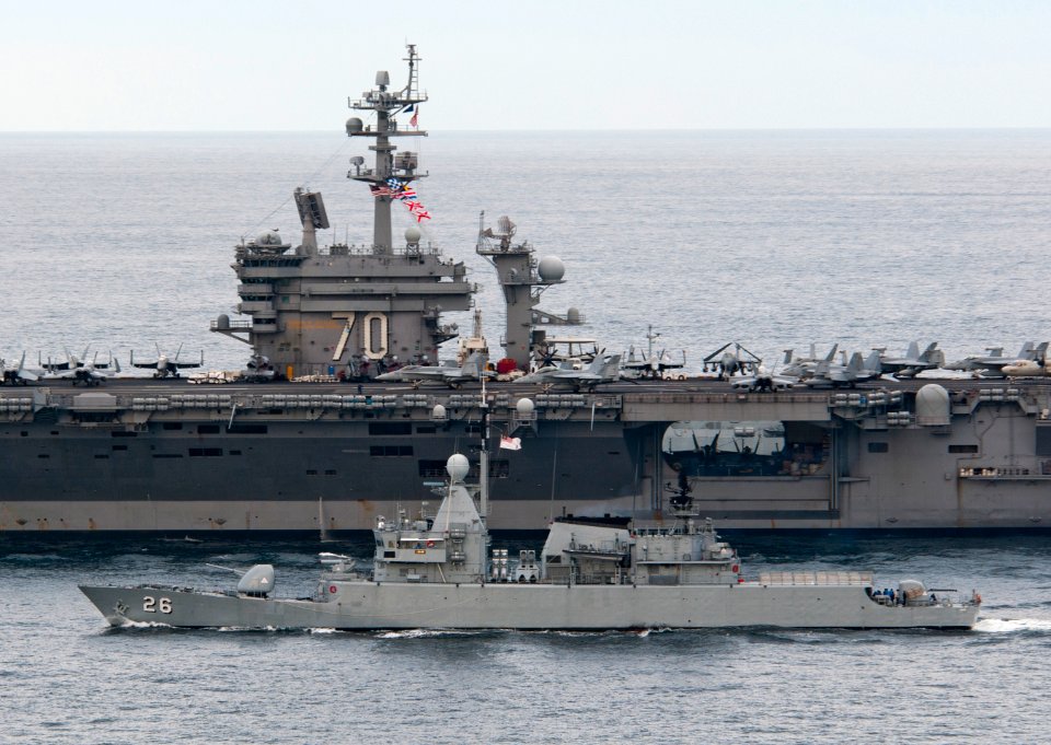 US Navy 110126-N-7981E-460 The Nimitz-class aircraft carrier USS Carl Vinson (CVN 70) leads the Royal Malaysian Navy frigate KD Lekir (FF 26) durin