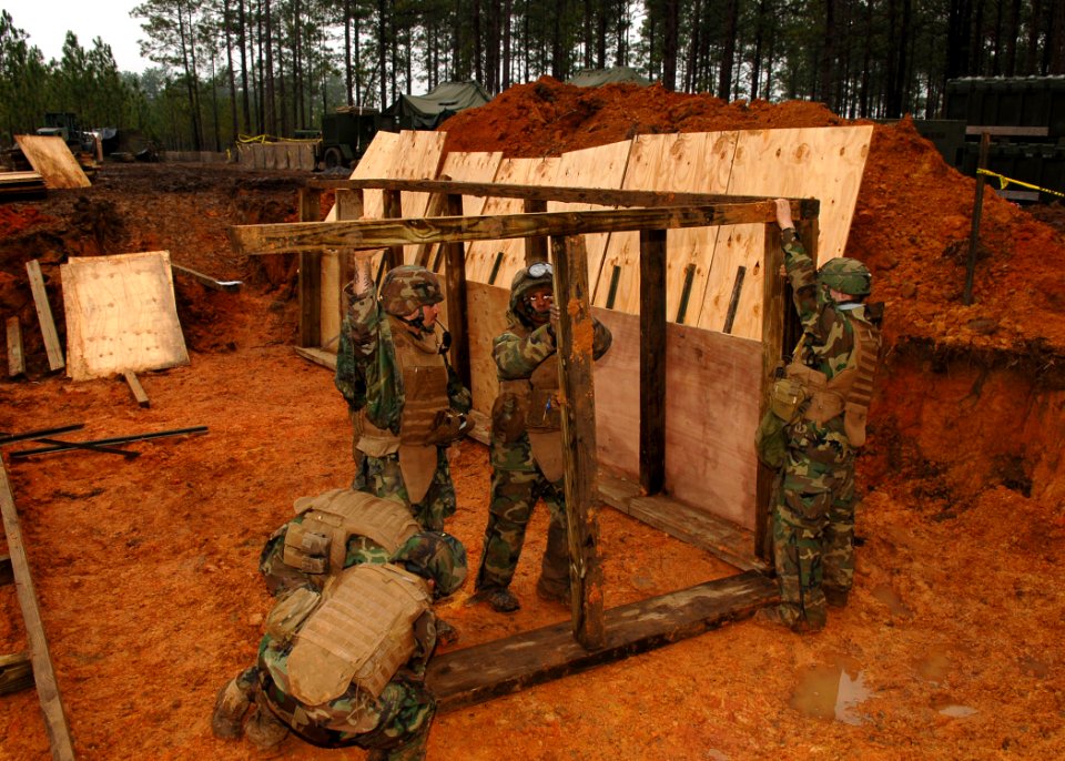 US Navy 110125-N-8816D-018 Seabees assigned to Naval Mobile Construction Battalion (NMCB) 133 build a heavy timber bunker during a field training e