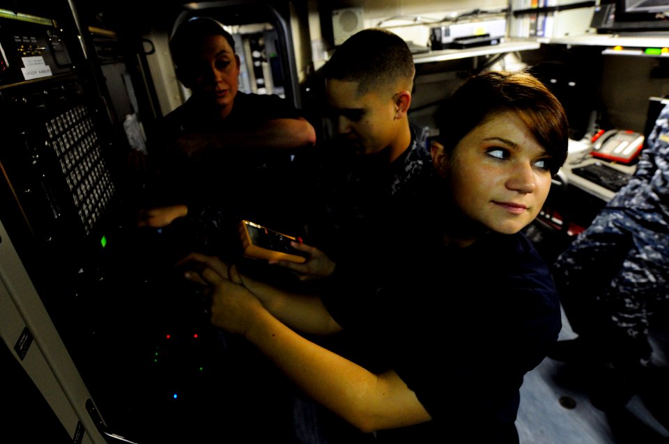 US Navy 110105-N-MD252-200 Sailors assigned to the intel department aboard the Nimitz-class aircraft carrier USS Carl Vinson (CVN 70), troubleshoot