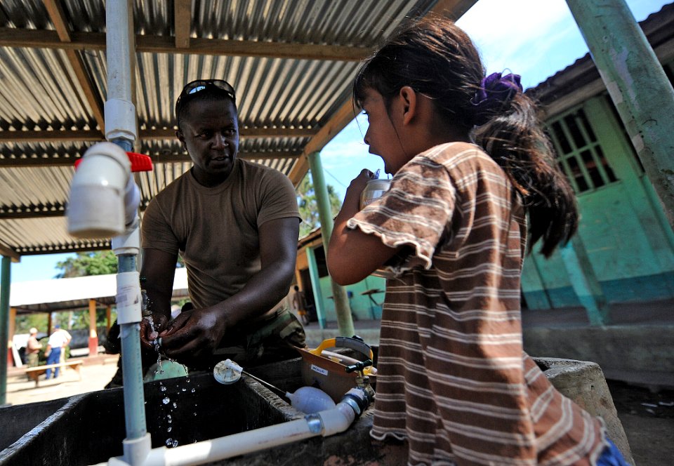 US Navy 110128-N-7589W-491 Utilitiesman 2nd Class George Githiomi, assigned to Naval Mobile Construction Battalion (NMCB) 28,