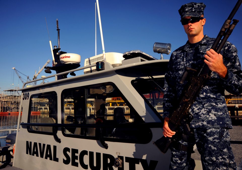 US Navy 110124-N-4332C-386 Master-at-Arms Seaman Kyle Chapleau patrols the San Diego Harbor