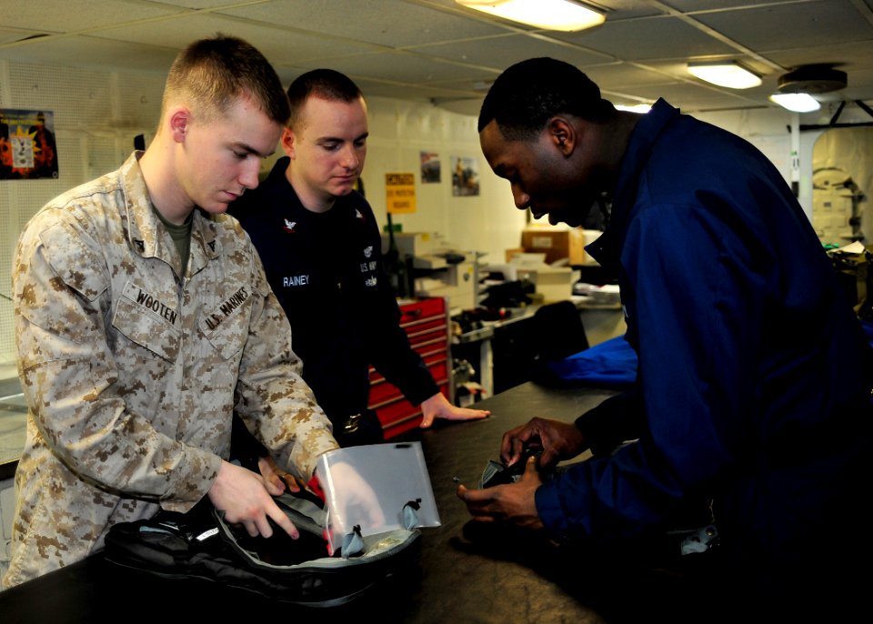 US Navy 110120-N-1287L-005 Sailors conduct a 360-day inspection on life preserver units for use by pilots aboard the aircraft carrier USS Enterpris