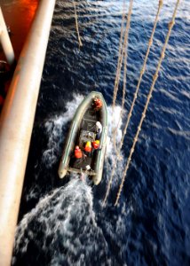 US Navy 110129-N-3374C-026 Sailors maneuver a rigid-hull inflatable boat during training operations assigned to the aircraft carrier USS George H.W