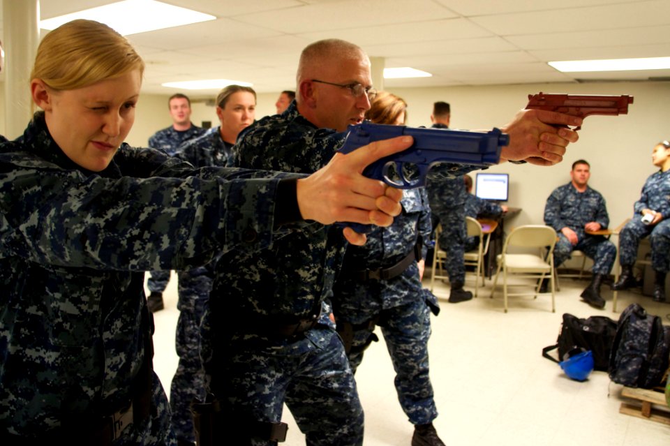 US Navy 110120-N-9643K-037 Sailors assigned to amphibious assault ship USS Bonhomme Richard (LHD 6) train on the proper handling of the M9 service
