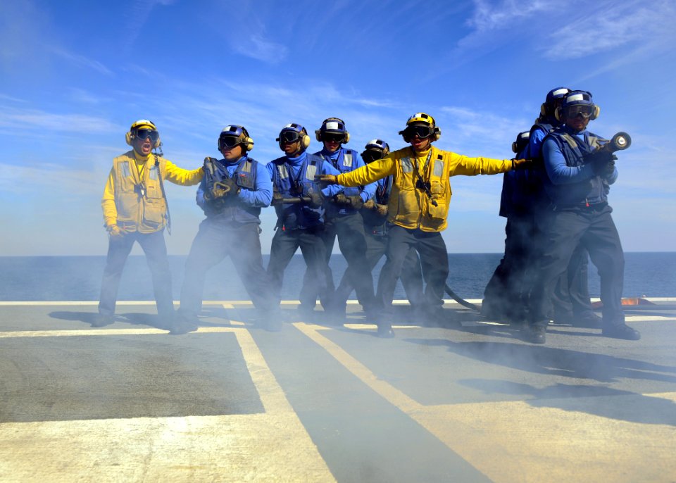 US Navy 110130-N-3374C-281 Sailors aboard the aircraft carrier USS George H.W. Bush (CVN 77) simulate extinguishing a fire during a mass casualty d