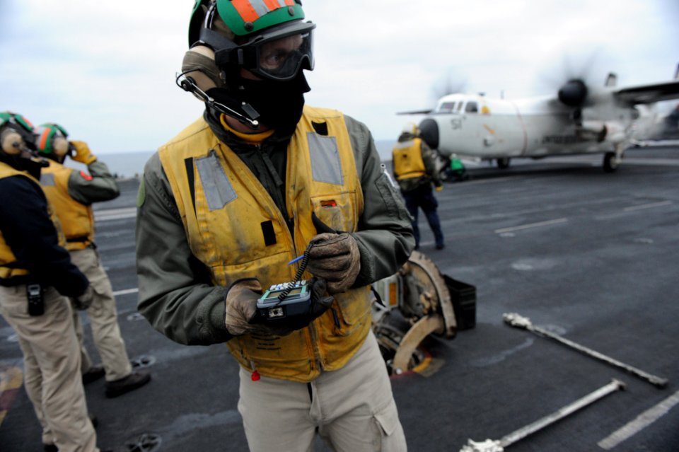 US Navy 110127-N-7676W-245 Lt. Andrew Wiese evaluates a catapult capacity selector valve (CSV) calculator provided by the Office of Naval Research