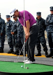 US Navy 110125-N-4590G-084 Professional golfer Bryce Molder putts on the flight deck of the aircraft carrier USS Ronald Reagan (CVN 76)