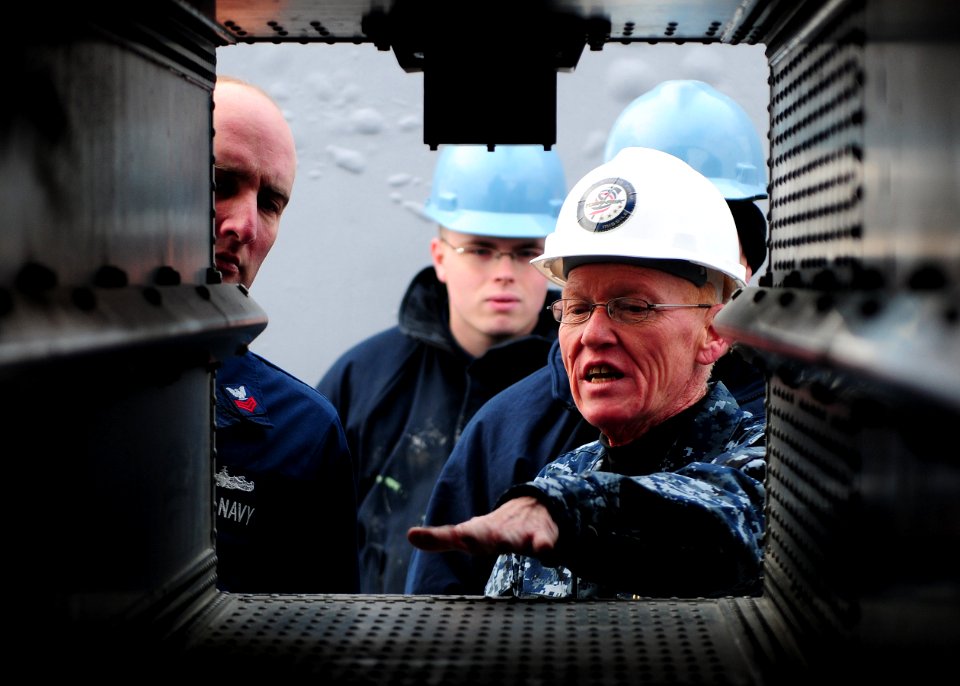US Navy 110126-N-5538K-005 Master Chief Fire Controlman Thomas E. Ward discusses the maintenance of a NATO Sea Sparrow Missile System launcher