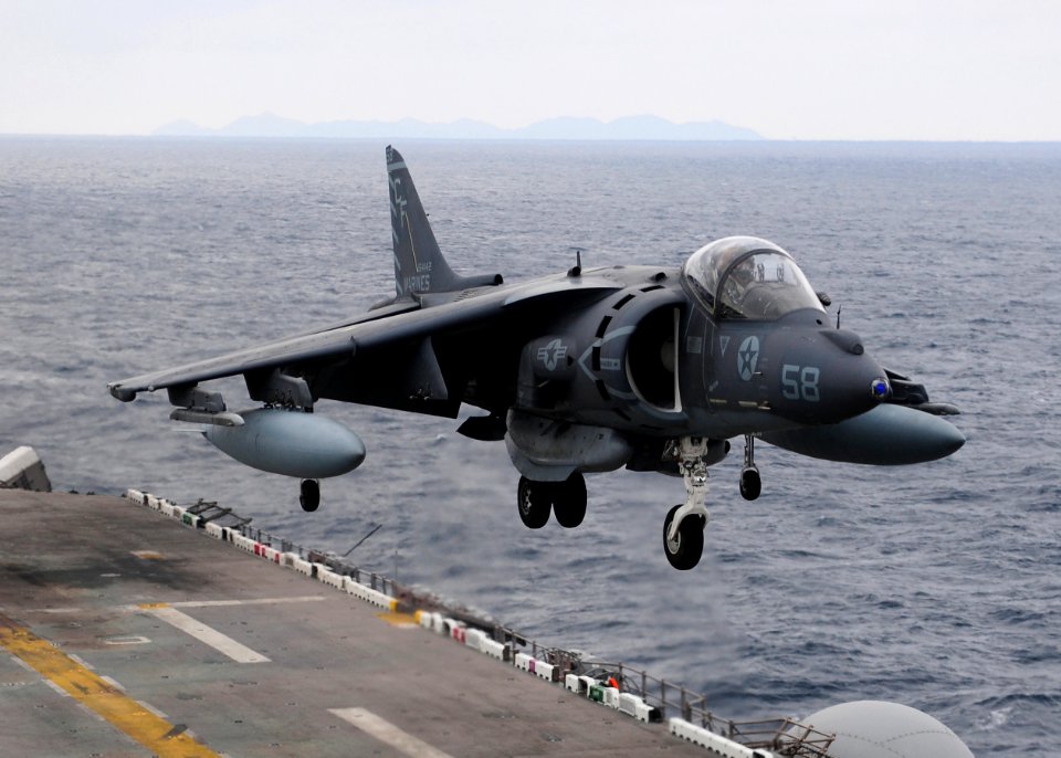 US Navy 110126-N-5538K-262 An AV-8B Harrier jet aircraft assigned to Marine Attack Squadron (VMA) 542 lands on the flight deck of the forward-deplo