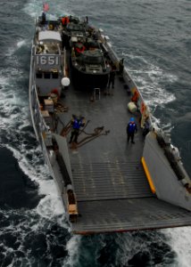 US Navy 110125-N-8607R-040 Landing Craft Utility (LCU) 1651 approaches the well deck of USS Essex (LHD 2) photo