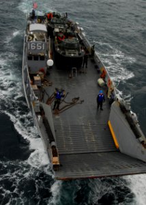 US Navy 110125-N-8607R-040 Landing Craft Utility (LCU) 1651 approaches the well deck of USS Essex (LHD 2)