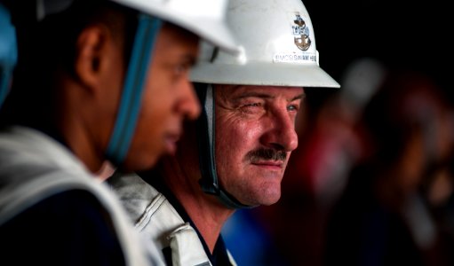 US Navy 110202-N-2055M-021 Senior Chief Boatswain's Mate Thomas Hengel stands as a safety observer during a replenishment at sea