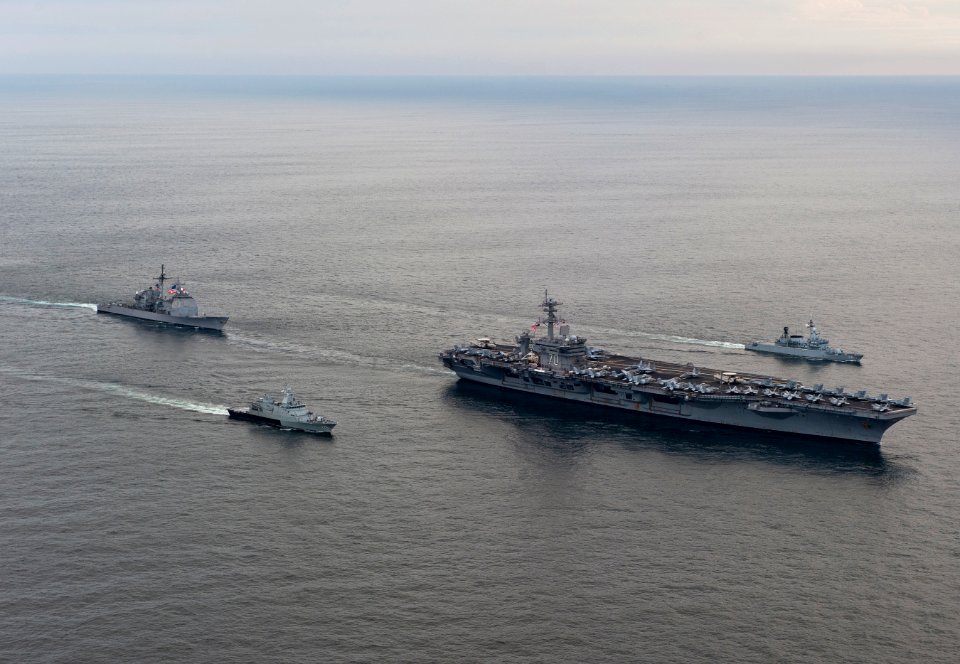 US Navy 110126-N-7981E-108 The Nimitz-class aircraft carrier USS Carl Vinson (CVN 70) leads the Royal Malaysian Navy frigate KD Lekir (FF 26) and c