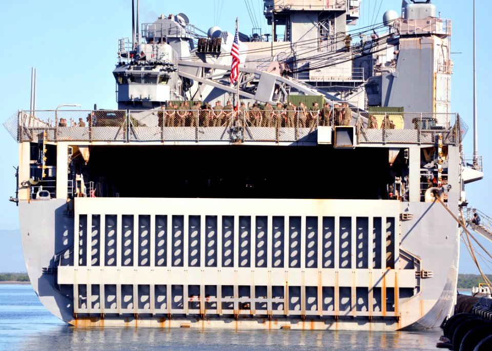 US Navy 110126-N-8241M-012 Sailors and Marines aboard USS Gunston Hall (LSD 44) prepare to shift colors before getting underway after a weeklong po