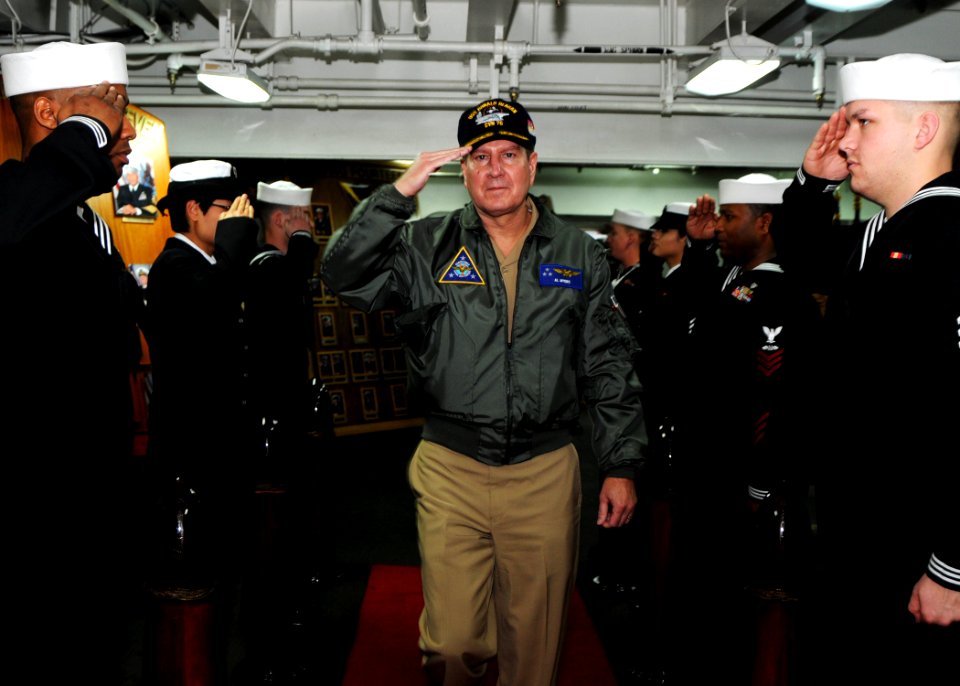 US Navy 110125-N-3178C-137 Vice Adm. Al Myer renders honors as he is piped ashore on the ceremonial quarterdeck of USS Ronald Reagan (CVN 76) foll