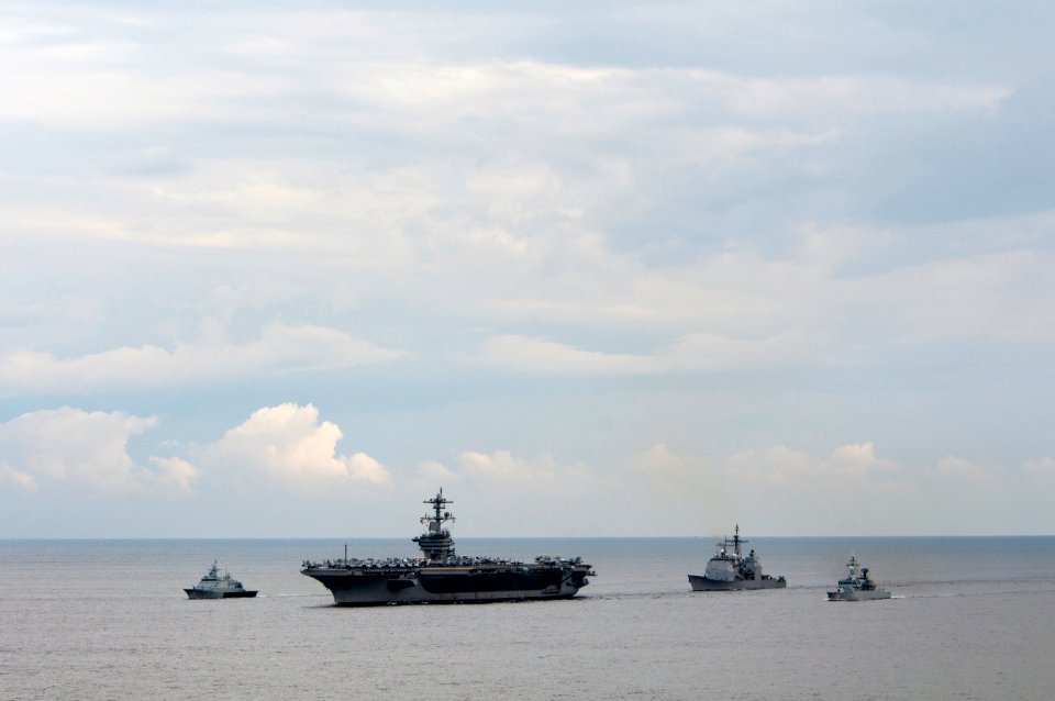 US Navy 110126-N-7981E-473 The Nimitz-class aircraft carrier USS Carl Vinson (CVN 70) leads the Royal Malaysian Navy frigate KD Lekir (FF 26) and c