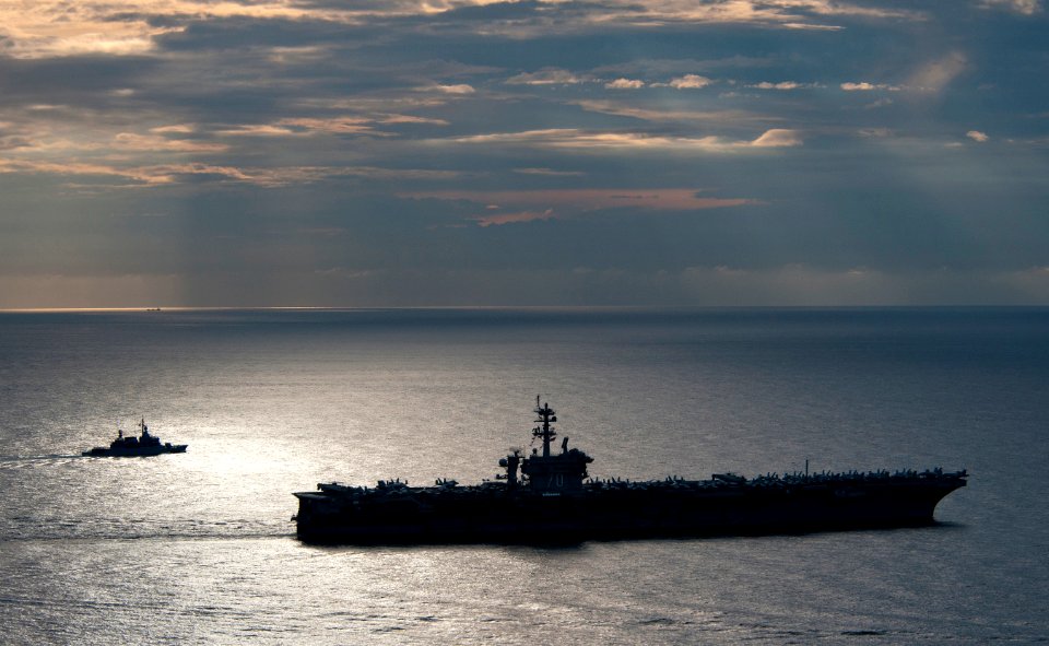US Navy 110126-N-7981E-592 The Nimitz-class aircraft carrier USS Carl Vinson (CVN 70) leads the Royal Malaysian Navy frigate KD Lekir (FF 26) durin