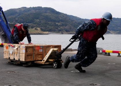 US Navy 110125-N-5538K-057 Sailors move ordnance during an ammunition onload aboard USS Essex (LHD 2)