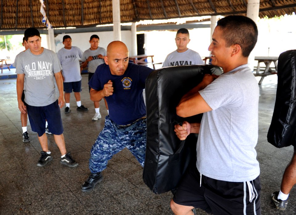 US Navy 110201-N-2984R-009 Chief Master-at-Arms Rodrigo Celones demonstrates proper striking techniques to a group of Guatemalan sailors participat