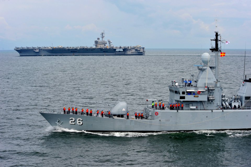 US Navy 110126-N-6006S-065 The Royal Malaysian frigate Lekir passes the Nimitz-class aircraft carrier USS Carl Vinson (CVN 70) during a transit of
