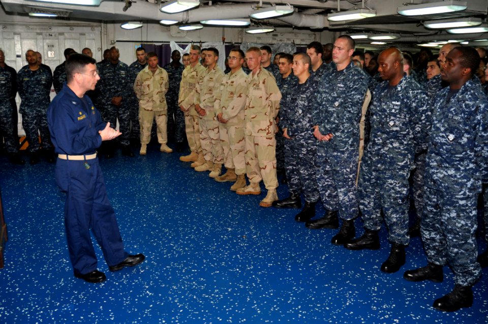 US Navy 110127-N-7293M-223 Capt. Peter Pagano, commander of Amphibious Squadron (PHIBRON) 4, answers questions during an all-hands call with the cr