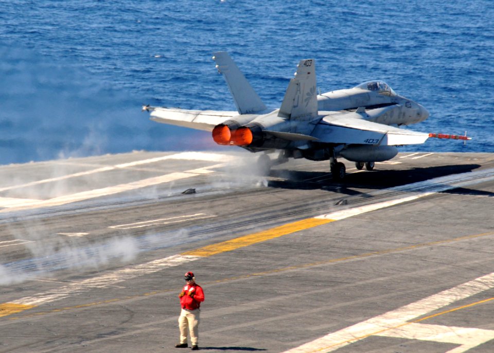 US Navy 110129-N-7004H-063 An F-A-18A- Hornet takes off from USS George H.W. Bush (CVN 77)