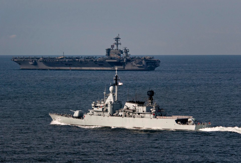 US Navy 110126-N-7981E-232 The Nimitz-class aircraft carrier USS Carl Vinson (CVN 70) leads the Royal Malaysian Navy frigate KD Lekir (FF 26) durin