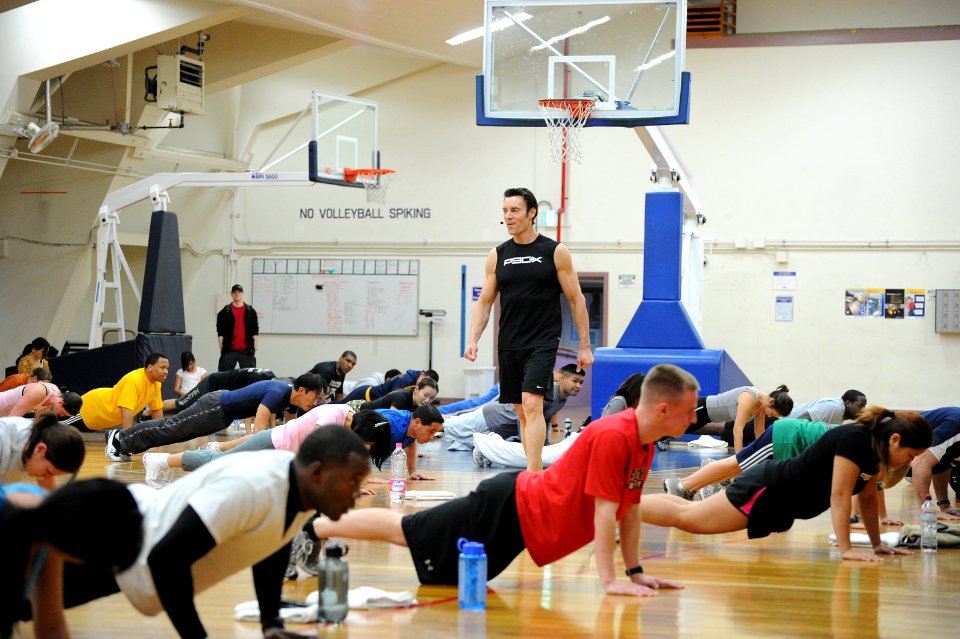 US Navy 110203-N-2858S-335 Tony Horton, creator of the P90X fitness program, counts fan's pushups during a training demonstration at Naval Air Faci