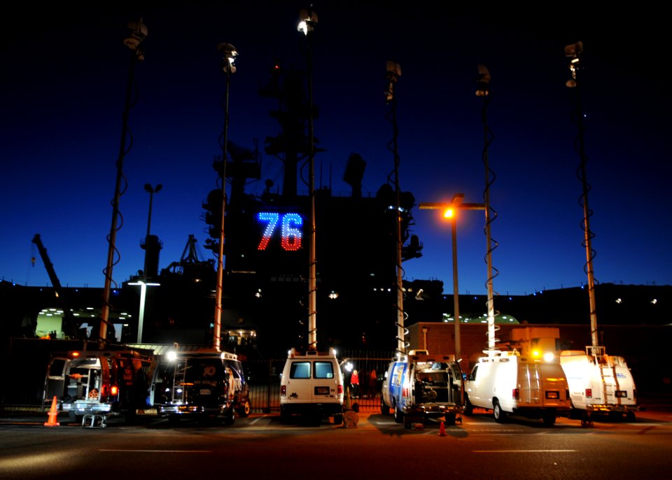 US Navy 110202-N-4590G-102 Local news media vans are parked near USS Ronald Reagan (CVN 76) to report the ship's departure from San Diego