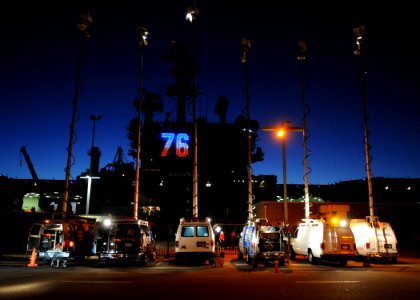US Navy 110202-N-4590G-102 Local news media vans are parked near USS Ronald Reagan (CVN 76) to report the ship's departure from San Diego