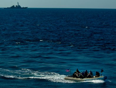 US Navy 110128-N-9589S-275 The visit, board, search and seizure team assigned to USS Truxtun (DDG 103) conducts a training exercise as USS Monterey photo