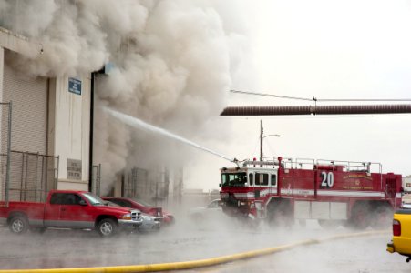US Navy 110127-N-5319A-013 Firefighters work to put out a warehouse fire at Naval Station Norfolk photo