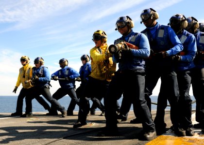 US Navy 110130-N-3374C-211 Sailors aboard the aircraft carrier USS George H.W. Bush (CVN 77) simulate extinguishing a fire during a mass casualty d