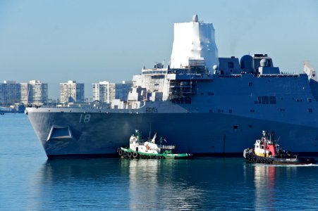 US Navy 110204-N-ZC343-539 USS New Orleans (LPD 18), assisted by tugboats, departs dry-dock to return to Naval Base San Diego