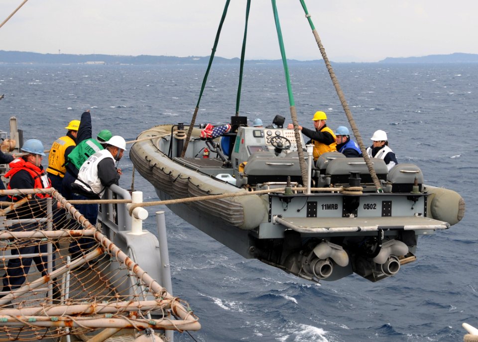 US Navy 110130-N-6692A-022 Sailors aboard the amphibious transport dock ship USS Denver (LPD 9) launch a rigid-hull inflatable boat t