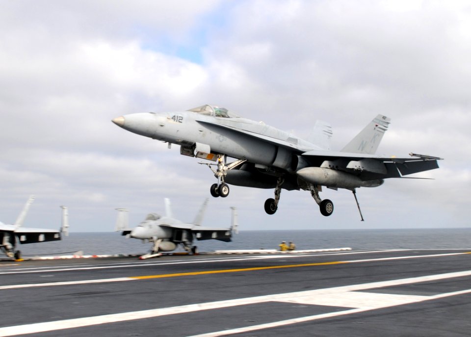 US Navy 110205-N-4590G-431 An F-A-18C Hornet lands aboard USS Ronald Reagan (CVN 76)
