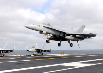 US Navy 110205-N-4590G-431 An F-A-18C Hornet lands aboard USS Ronald Reagan (CVN 76)