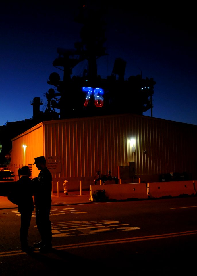 US Navy 110202-N-4590G-117 Machinist's Mate 2nd Class Samuel Piper and his wife say their goodbyes on the pier near USS Ronald Reagan (CVN 76)