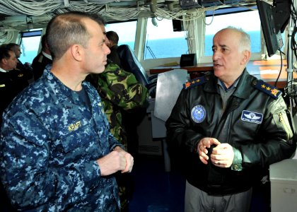 US Navy 110207-N-0569K-036 Rear Adm. Terry B. Kraft, left, commander of the Enterprise Carrier Strike Group, speaks with Turkish Air Force Maj. Gen photo