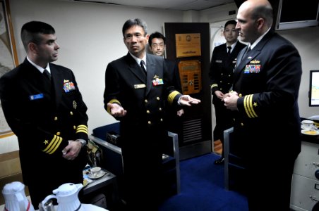 US Navy 110204-N-9818V-427 Japan Maritime Self-Defense Force Capt. Sumio Nagai, commander of Escort Division 15, meets with Cmdr. Dennis Velez, com photo