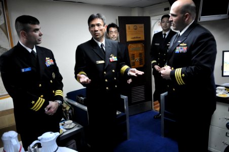 US Navy 110204-N-9818V-427 Japan Maritime Self-Defense Force Capt. Sumio Nagai, commander of Escort Division 15, meets with Cmdr. Dennis Velez, com