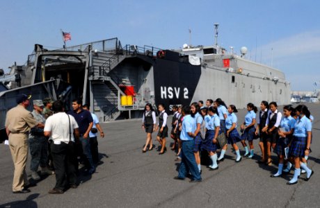 US Navy 110207-N-7589W-012 Students and faculty from Colegio Liceo Alpha ^ Omega approach the High Speed Vessel Swift (HSV 2) for a tour as part of