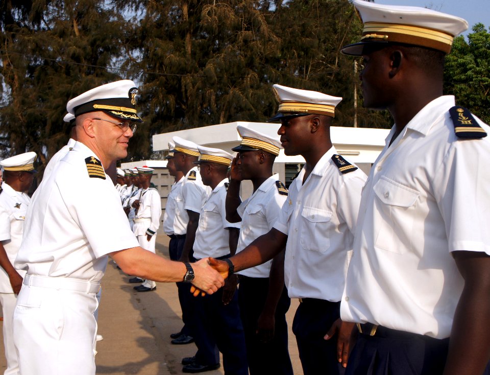 US Navy 110201-N-8855D-140 Capt. Dan Shaffer is greeted by Togolese sailors