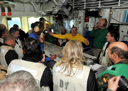 US Navy 110202-N-0569K-022 Lt. Cmdr. Charles E. Ardinger gives a tour of flight deck control aboard the aircraft carrier USS Enterprise (CVN 65) to